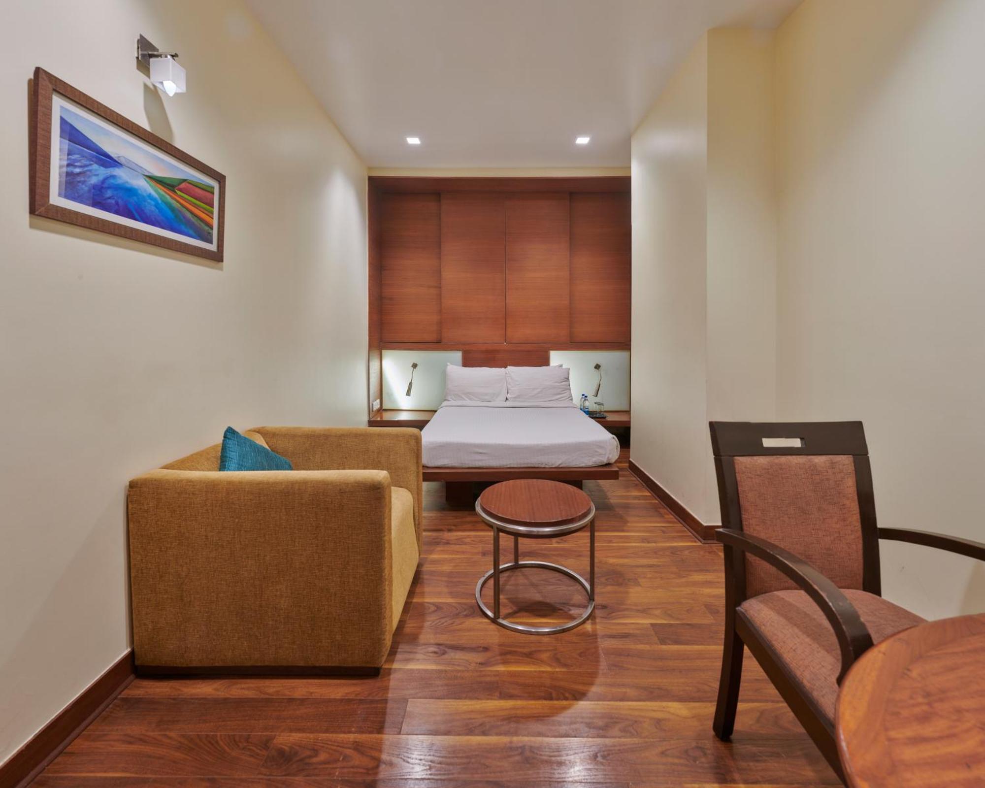 Hotel Studio Estique Poona Kamer foto