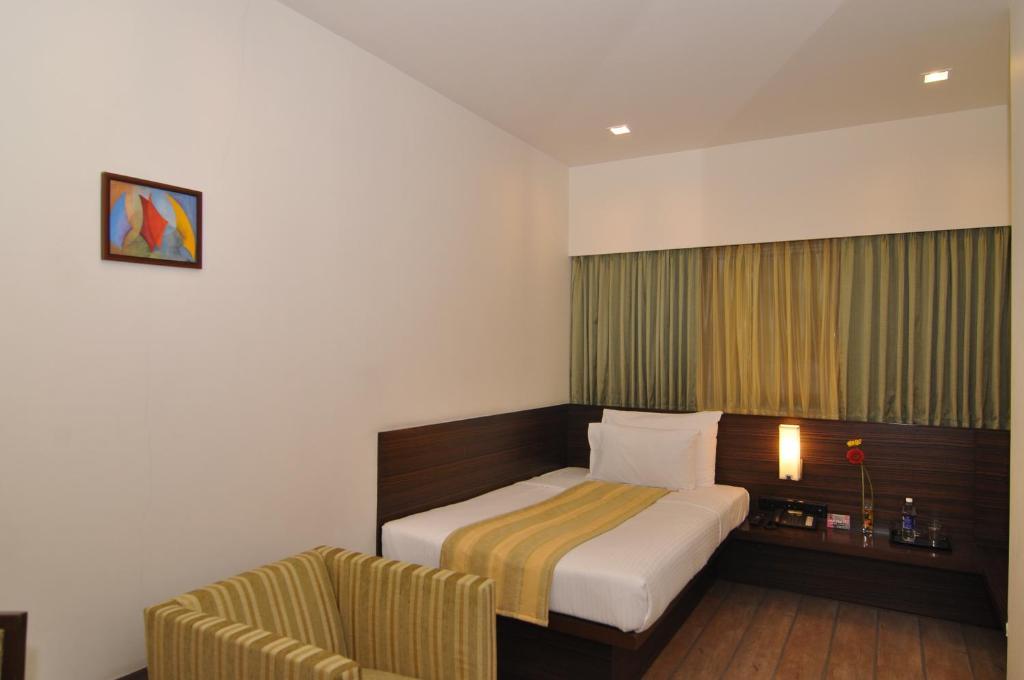 Hotel Studio Estique Poona Kamer foto